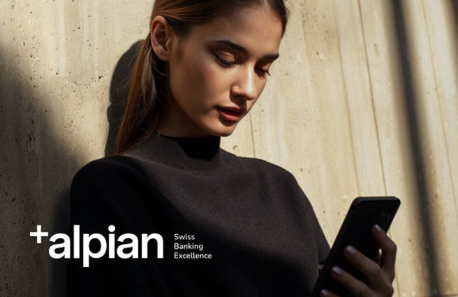 A smartphone in front of a black background.